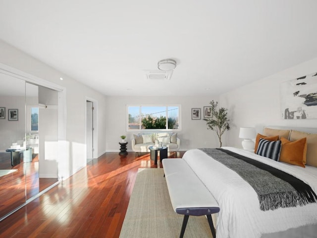 bedroom with hardwood / wood-style floors