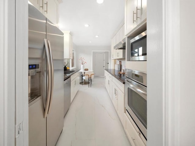 kitchen with stainless steel appliances and white cabinets