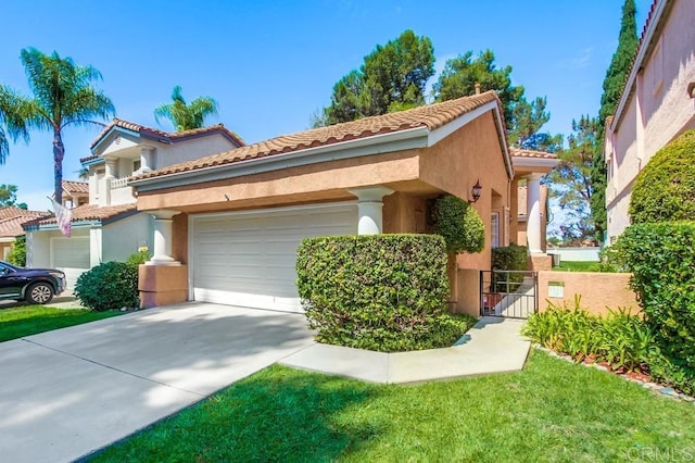 mediterranean / spanish home featuring a garage