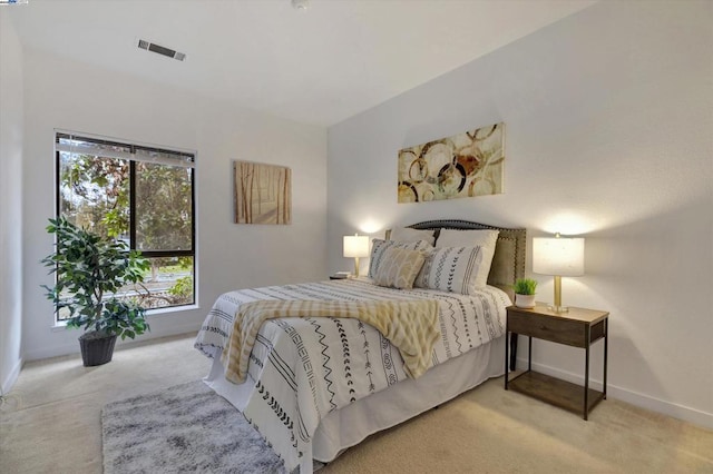 bedroom featuring light colored carpet