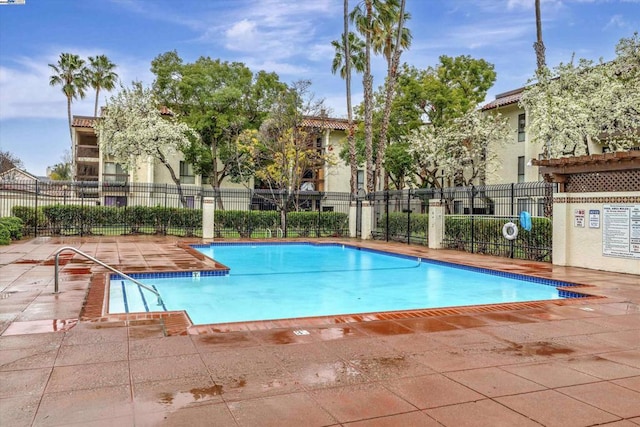 view of swimming pool with a patio area