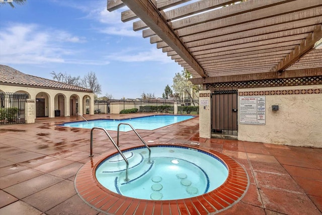 view of swimming pool with a pergola, a community hot tub, and a patio