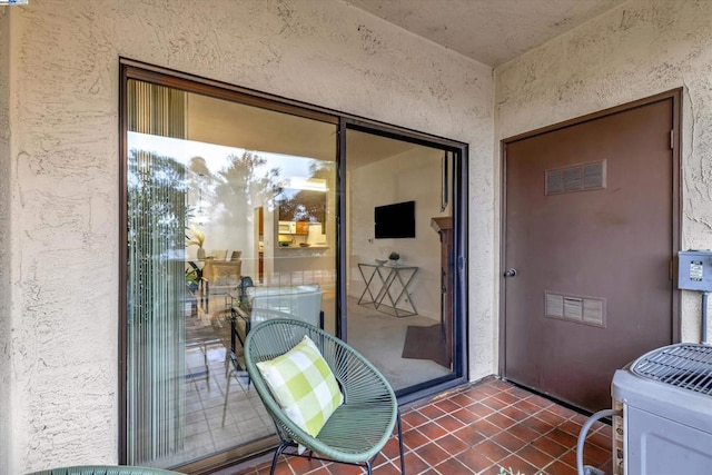 entrance to property featuring central AC unit