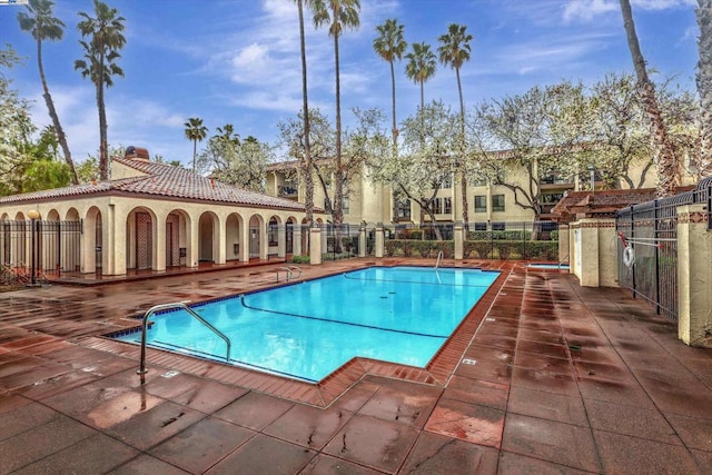 view of swimming pool featuring a patio area