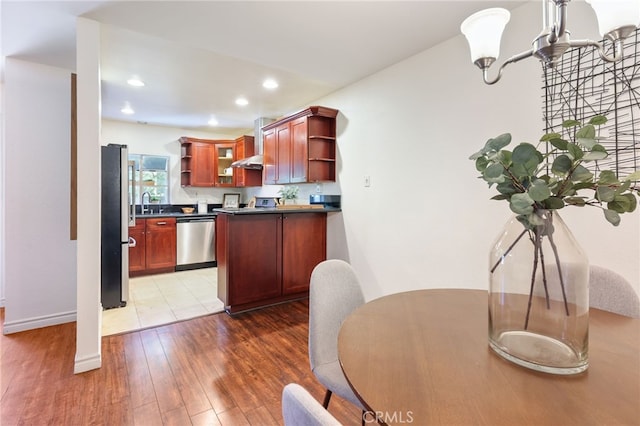 509 N Sierra Vista St Unit B, Monterey Park, CA 91755 - kitchen with open shelves, appliances with stainless steel finishes, dark countertops, light wood finished floors, and recessed lighting