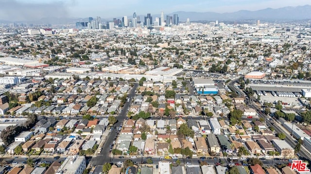 birds eye view of property featuring a mountain view