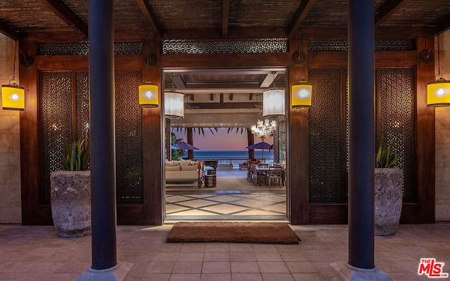 entrance to property with a patio area