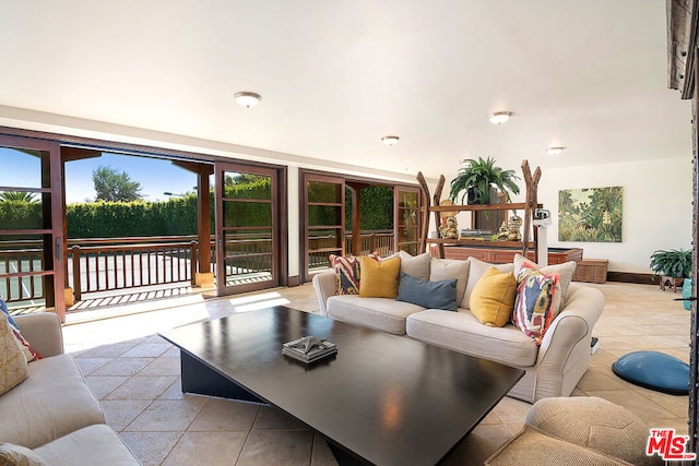 living room with light tile patterned floors