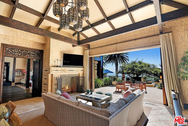 view of patio featuring an outdoor living space with a fireplace