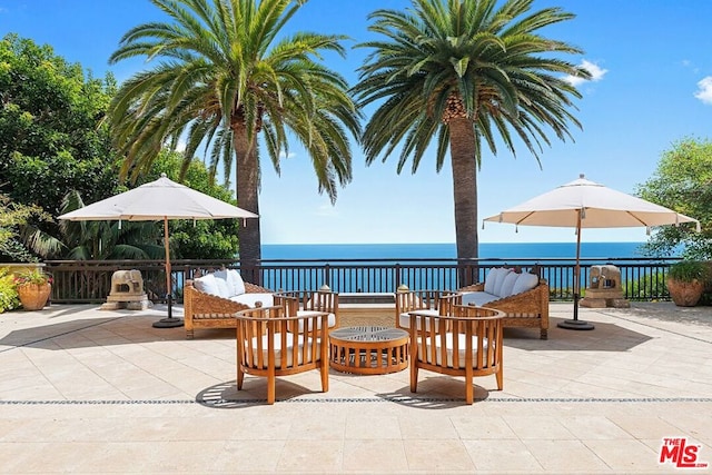 view of patio / terrace with an outdoor hangout area and a water view