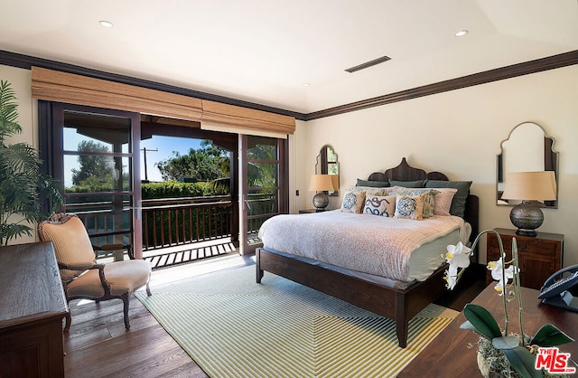 bedroom with multiple windows, access to exterior, crown molding, and dark wood-type flooring