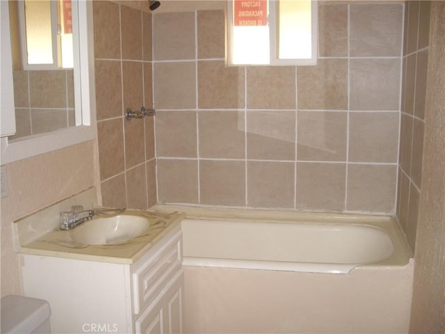 full bathroom with shower / bath combination, vanity, and toilet