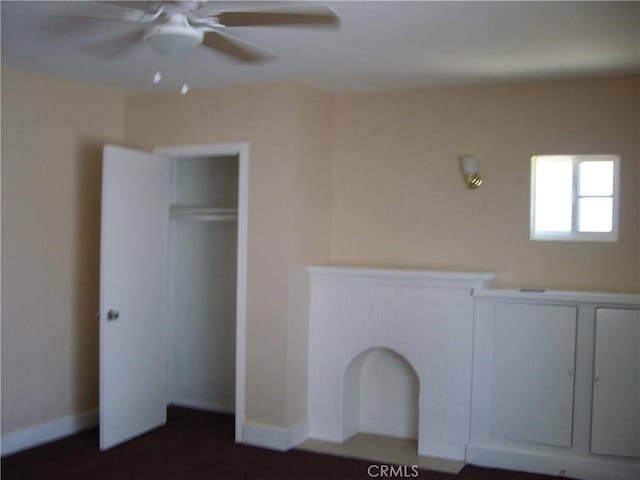 unfurnished bedroom featuring ceiling fan