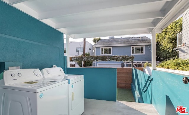 clothes washing area with washer and dryer