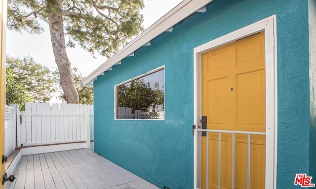 doorway to property with a deck