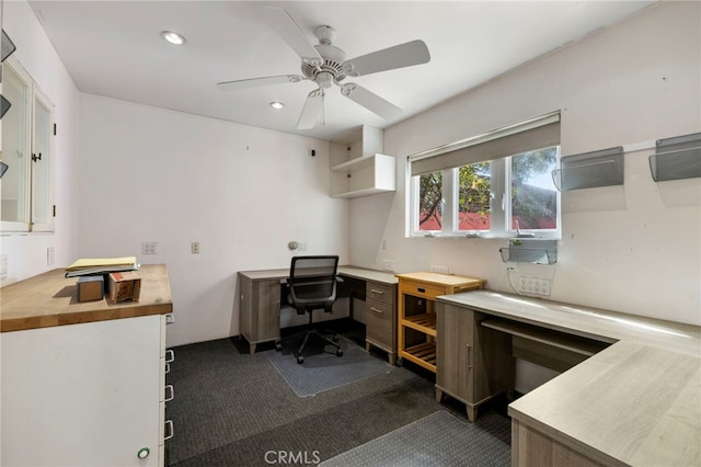 carpeted office with ceiling fan