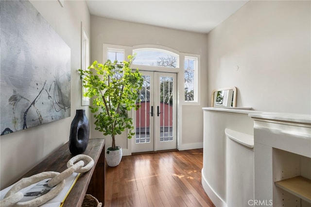 entryway with french doors and hardwood / wood-style flooring