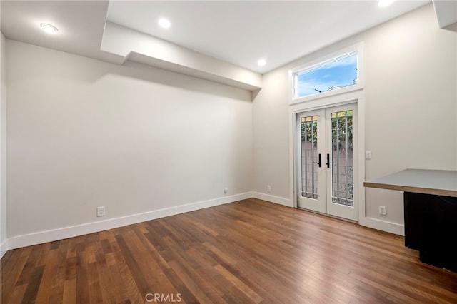 foyer featuring french doors and dark wood-type flooring