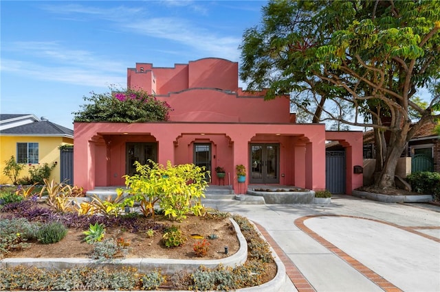 southwest-style home featuring french doors