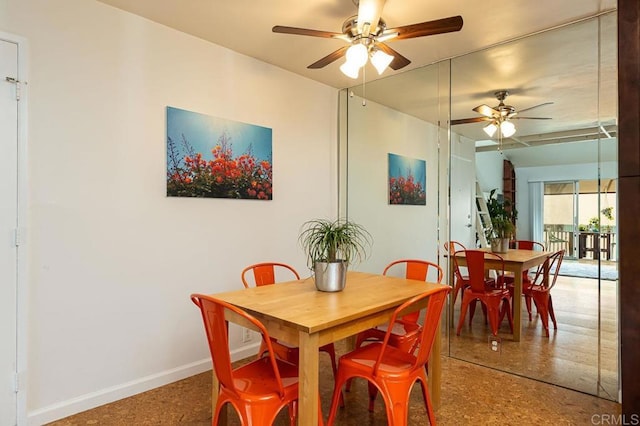 dining space featuring ceiling fan