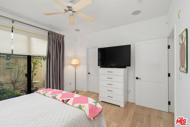 bedroom featuring ceiling fan and light hardwood / wood-style floors