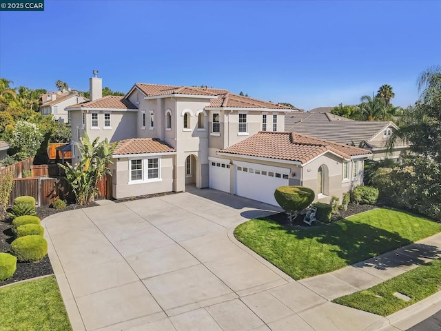 mediterranean / spanish-style house featuring a front lawn