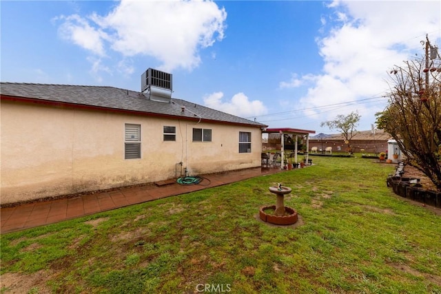 view of yard with central AC unit