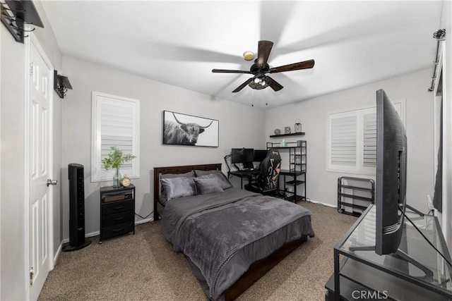 bedroom with ceiling fan and carpet