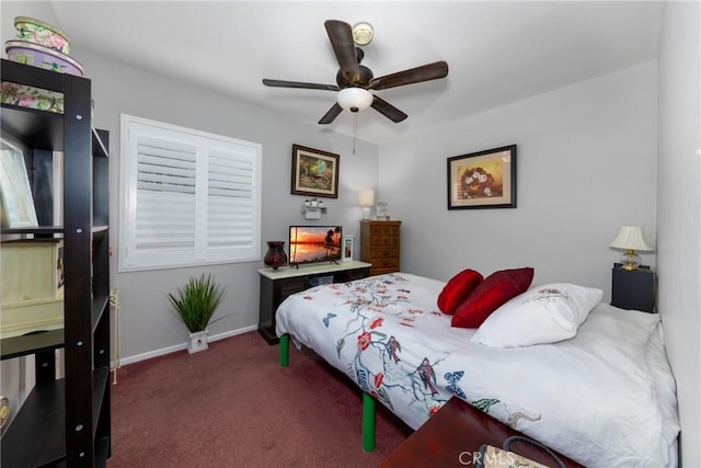 bedroom with dark carpet and ceiling fan