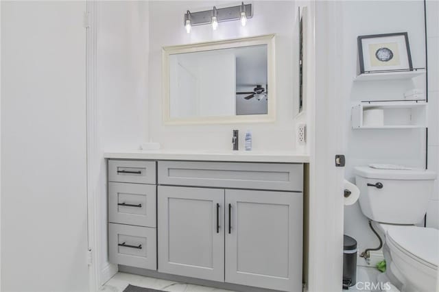 bathroom with vanity and toilet