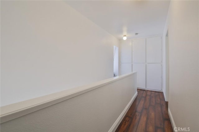 corridor with dark hardwood / wood-style floors