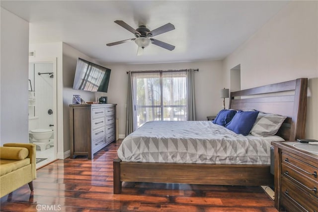 bedroom featuring dark wood-type flooring and ensuite bathroom