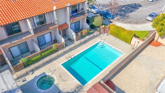 view of swimming pool with a patio