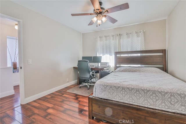 bedroom featuring ceiling fan and dark hardwood / wood-style flooring