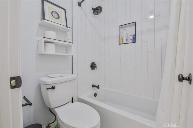 bathroom featuring shower / tub combo and toilet