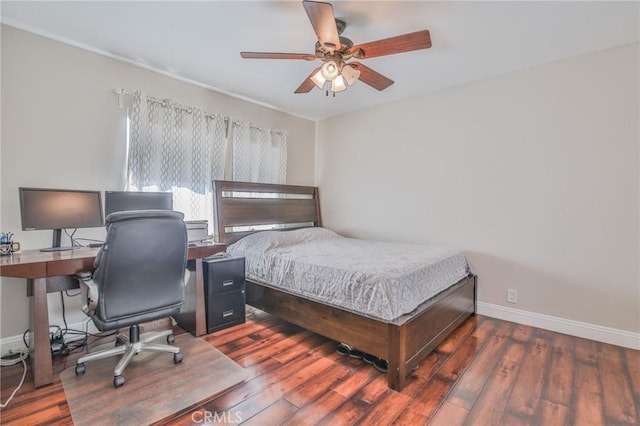 bedroom featuring dark hardwood / wood-style flooring and ceiling fan