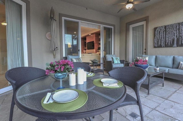 view of patio with outdoor lounge area and ceiling fan