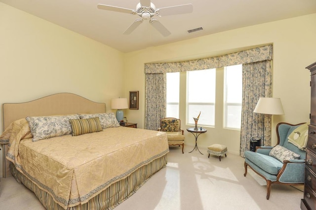 bedroom with light colored carpet and ceiling fan