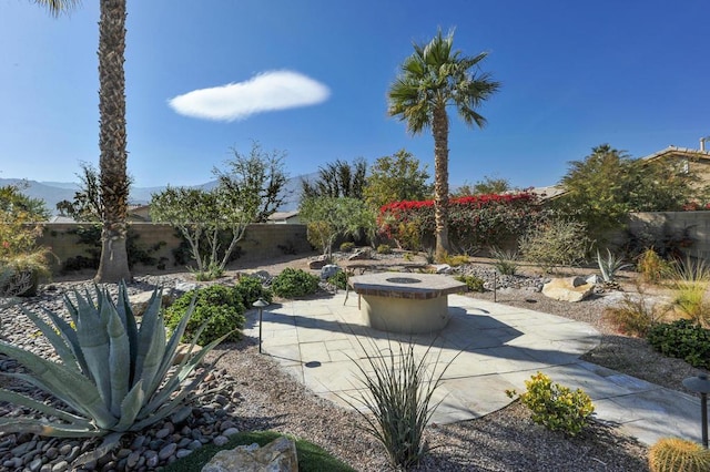 view of patio with an outdoor fire pit