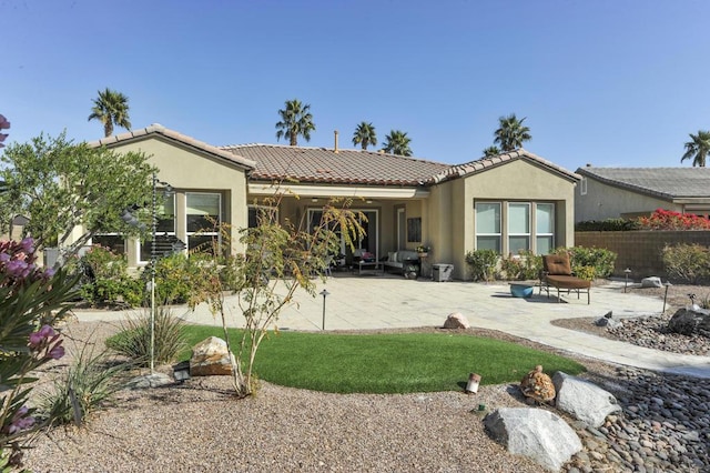 rear view of property with a patio area