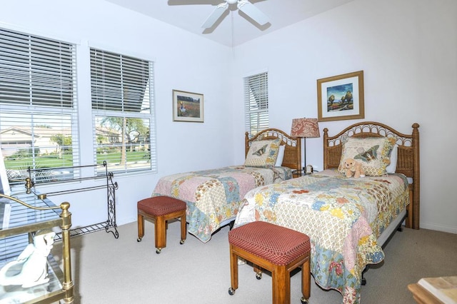 bedroom with ceiling fan and carpet flooring