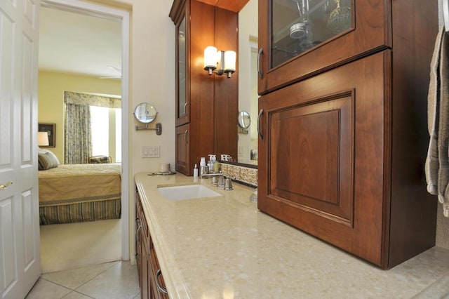 bathroom featuring tile patterned flooring and vanity