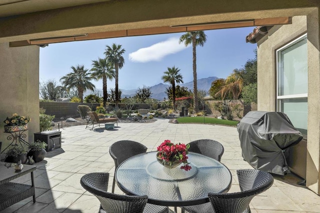 view of patio featuring grilling area and a mountain view