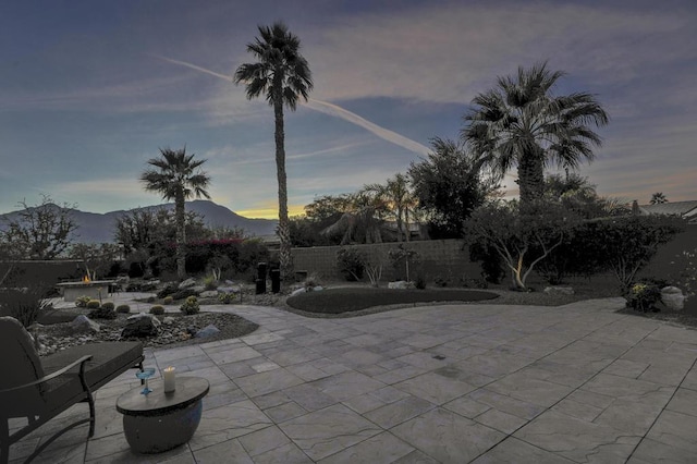 patio terrace at dusk with a mountain view