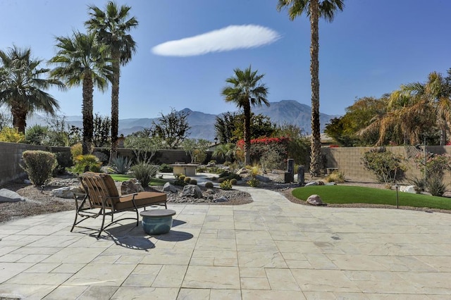 view of patio / terrace featuring a mountain view