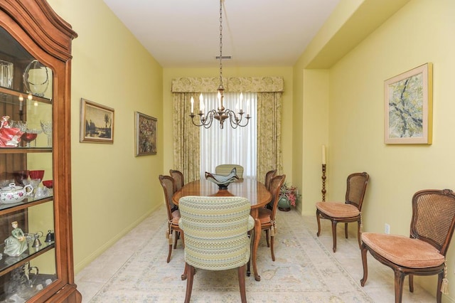 dining area featuring an inviting chandelier and light tile patterned floors