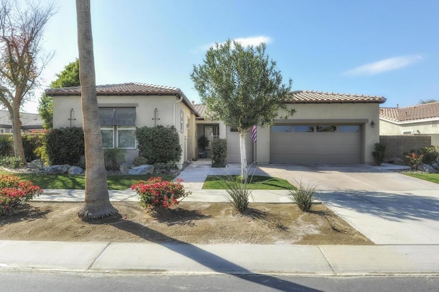 mediterranean / spanish house featuring a garage