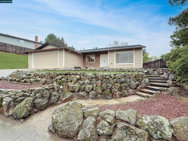 single story home featuring a garage