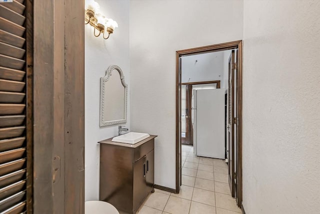 bathroom featuring tile patterned flooring and vanity