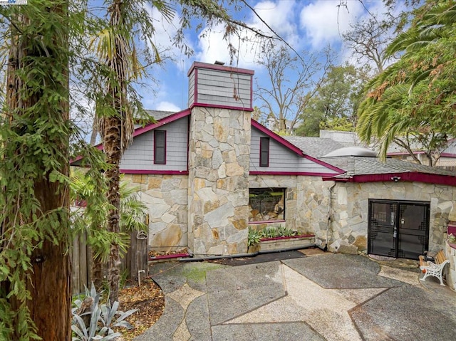 rear view of property featuring a patio area